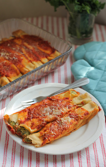 Food Lust People Love: Use your favorite greens to make Greens and Pea Manicotti, a lovely savory vegetarian main course of crepes filled with peas, goat cheese, ricotta and, of course, greens, covered in a fragrant tomato sauce.