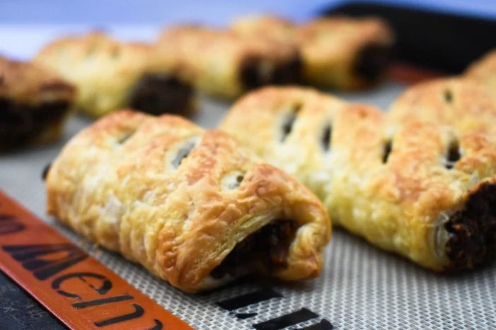 Mushroom & Chestnut Sausage Rolls Mushroom & Chestnut Sausage Rolls on a baking tray