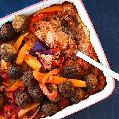 Vegan meatball rice bake in a baking dish.